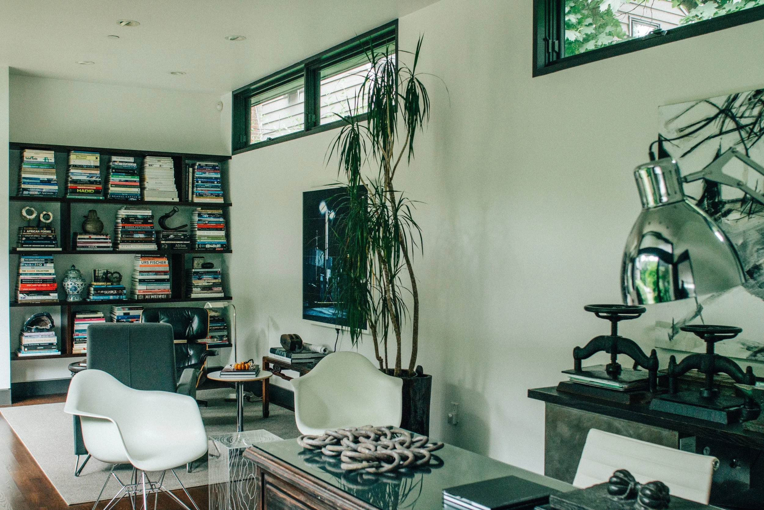 Modern study with bookshelves and collections — William Kaven Architecture