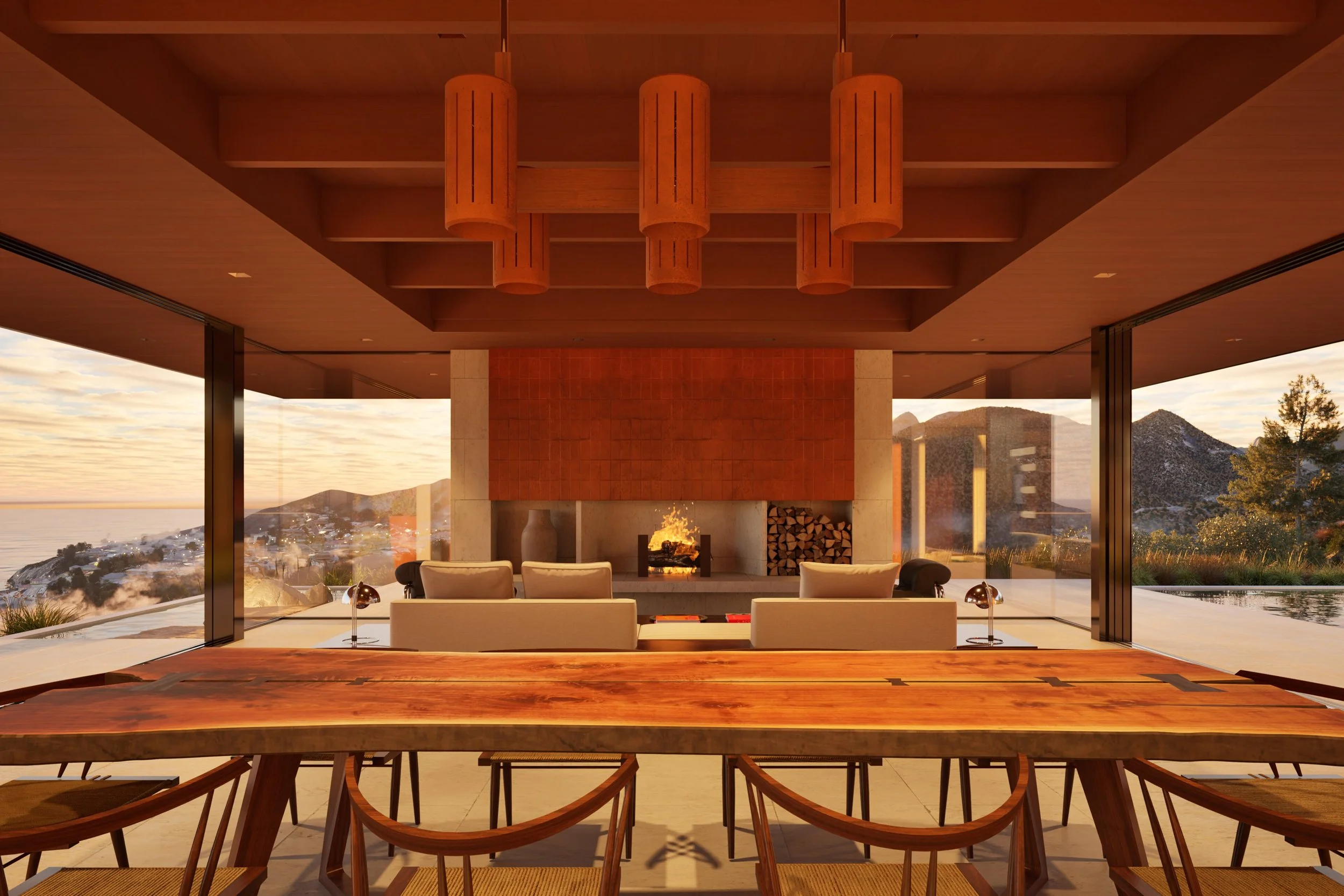 Long wooden dining room table with fireplace and view of Pacific Palisades  — Miramar residence by William Kaven Architecture