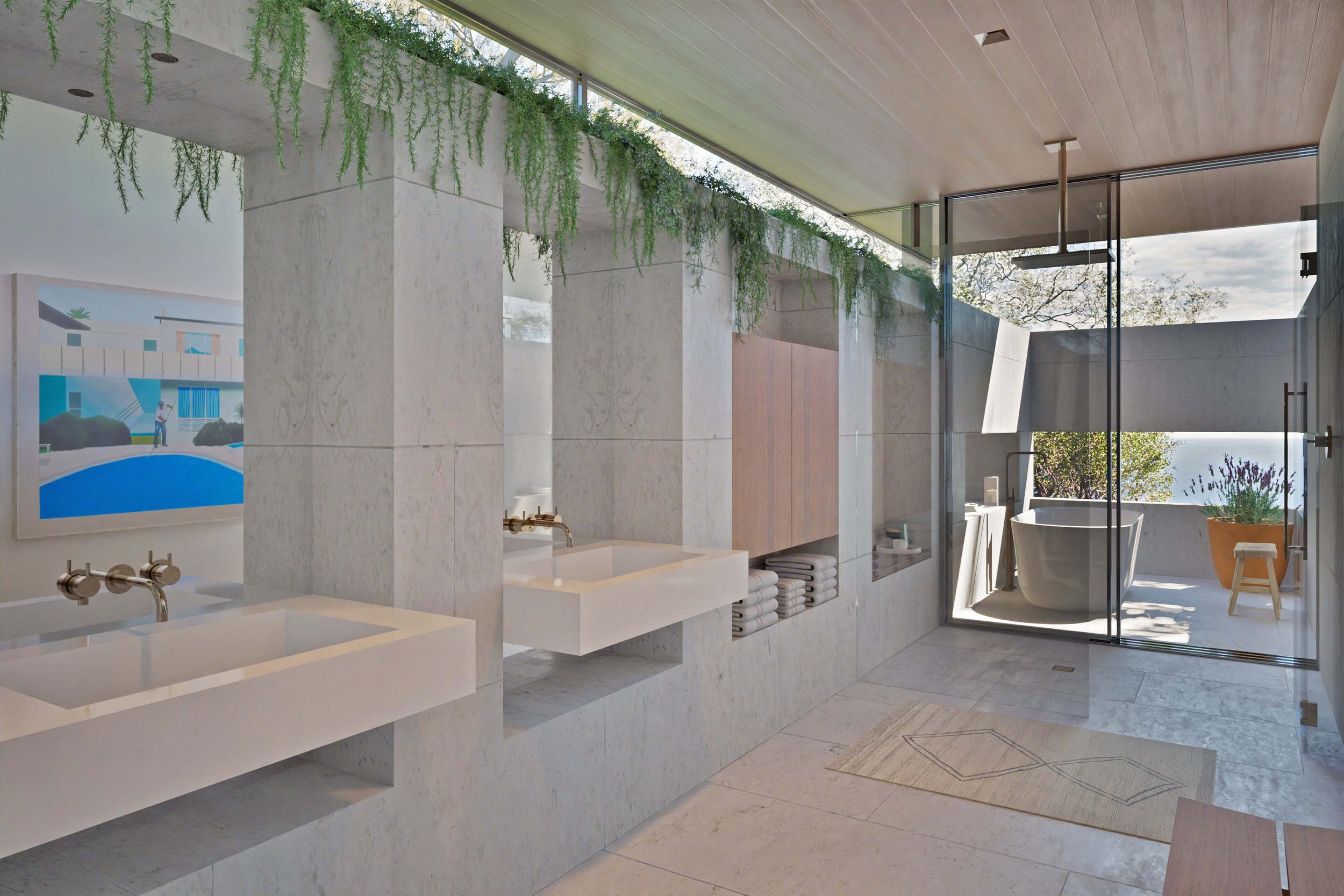 Primary bathroom with clerestory windows and hanging plants, with soaking tub in background Miramar residence by William Kaven Architecture