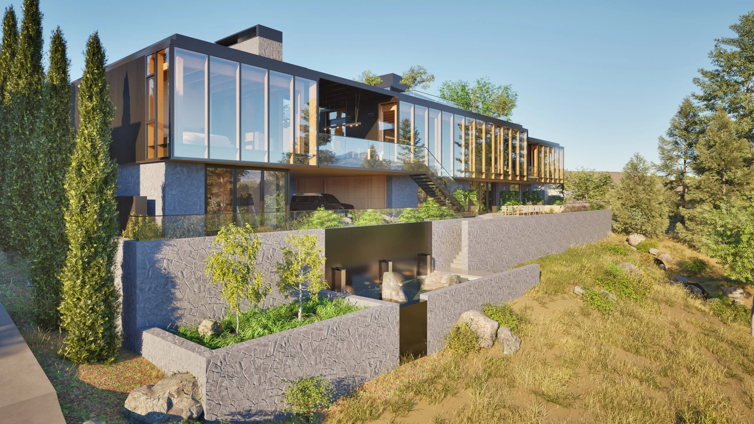 Angled view of modern house in Hood River, Oregon, with stone walls, shou sugi ban, and a water feature — William Kaven Architecture.