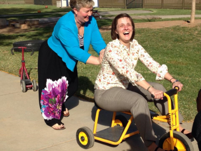 Riding the bike at the playground at Texas Tech as we dream about our Playground for the Grace Center!