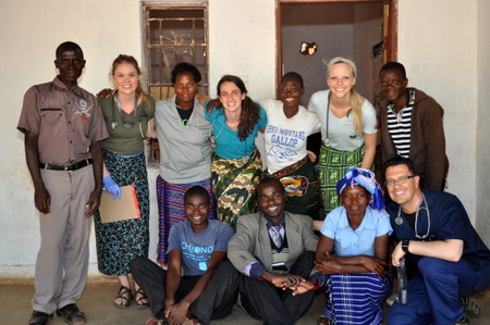 Our summer 2015 medical team with our CHE members. Kennedy and Henry, pictured here, both suffered loss to their homes in the storm. 