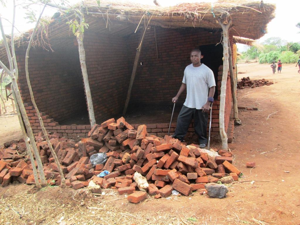 James in front of his rented home which was destroyed in the terrible storm last week.