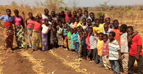 Pastor Phiri and the boys and girls of TImothy's and Patricia's Homes on the new land we are hoping to purchase soon!