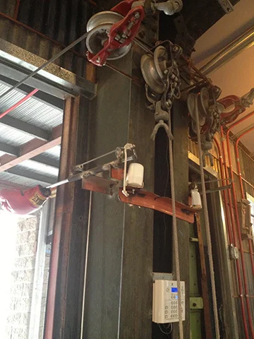 pulley systems repurposed to open door