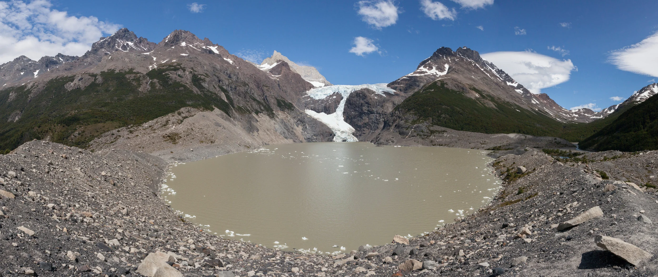 Los Perros Glacier. Small streams of water ran down the face of the rock next to Los Perros Glacier. We could hear the ice grumble and groan as we made our way to the campground. 