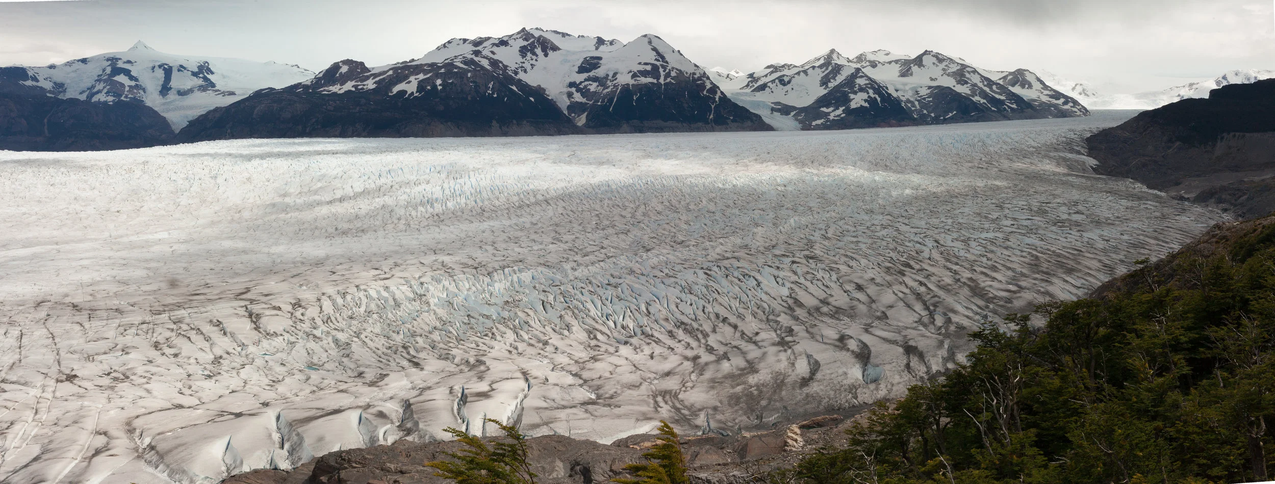 Grey Glacier and the Southern Patagonia Ice Field. As the clouds moved through, light danced across the glacier and blue pools of water shone like small gems. 
