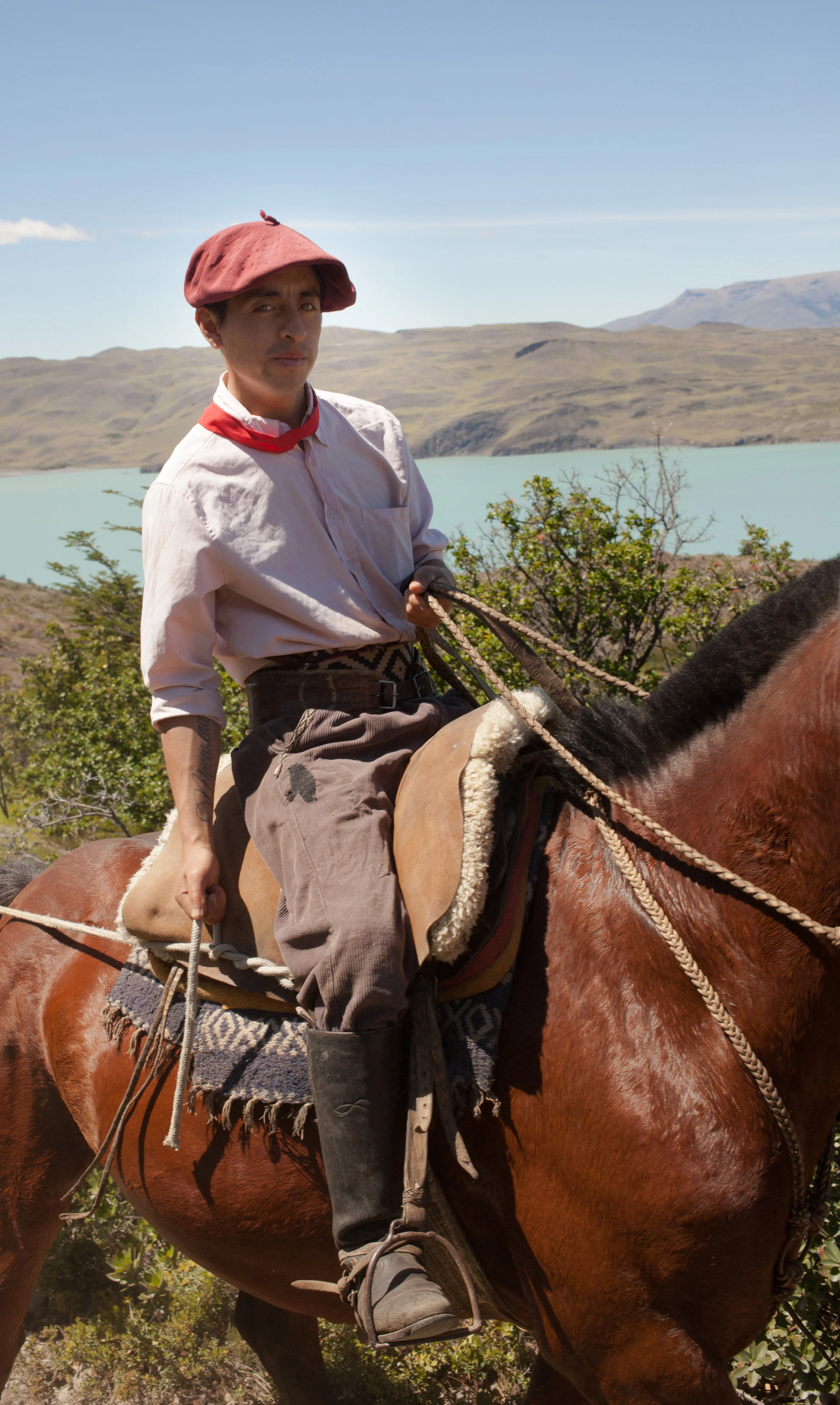A horseman leads a pack of horses carrying supplies along the trail from Chileno. 