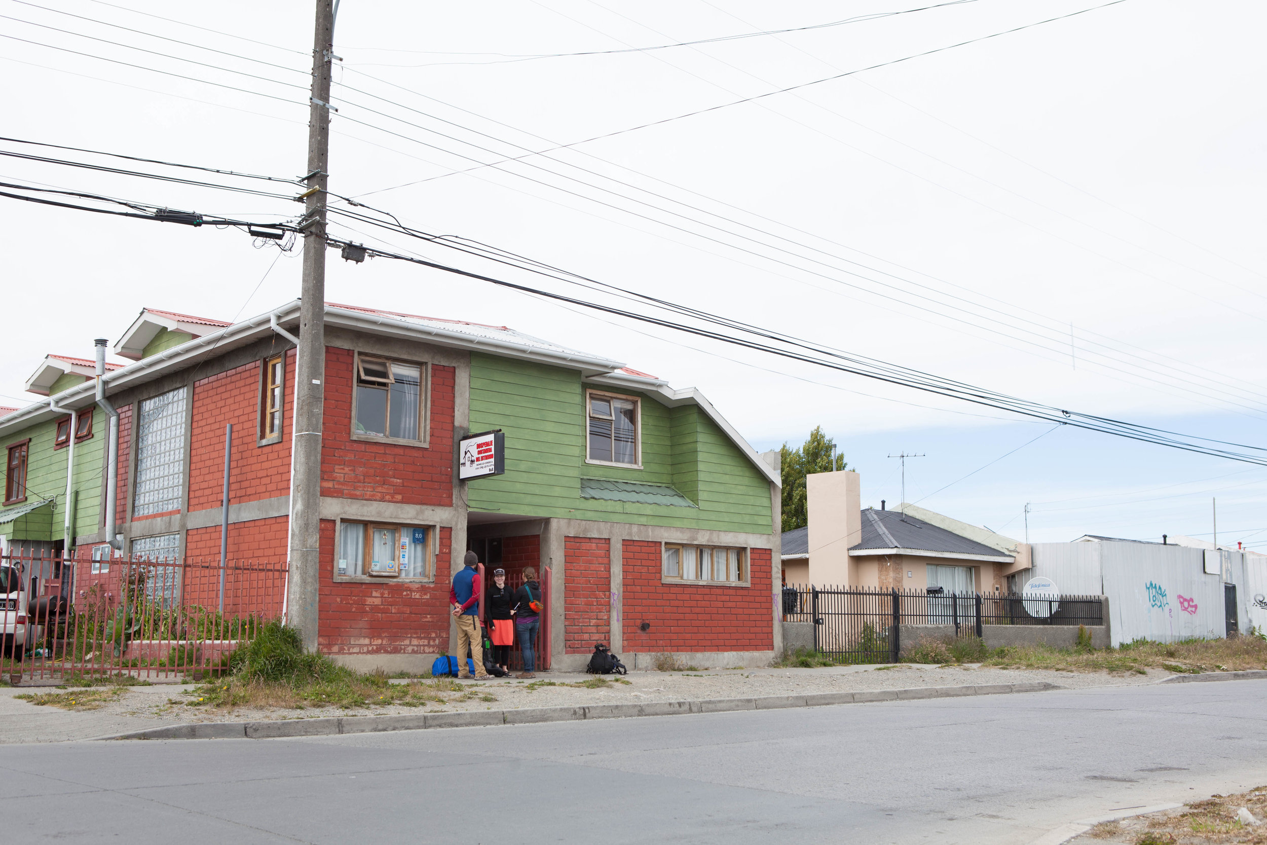 Hostel in Punta Arenas. Our Patagonia adventure began with a 3am check in at a small hostel in Punta Arenas. In the morning, our group of seven took a bus to Puerto Natales where we stocked up on food, fuel, and wine for an eight day trek through the Torres del Paine National park. 