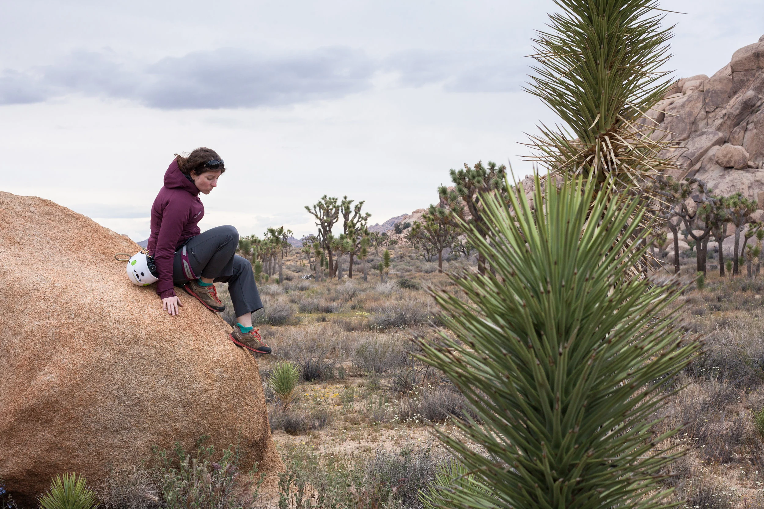 Rachel Morgan scrambles off of a boulder at Joshua Tree National Park. 