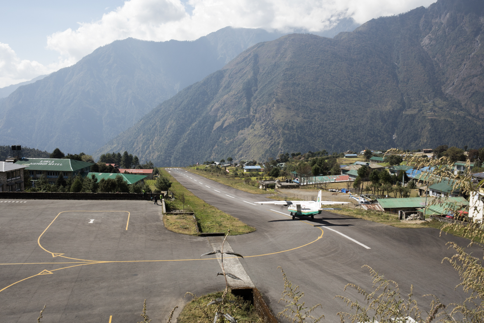 Lukla airport is said to be one of the most dangerous airports. The runway is short, and the weather temperamental. When we landed we felt the urgent catch of the brakes as we quickly came to a stop. 