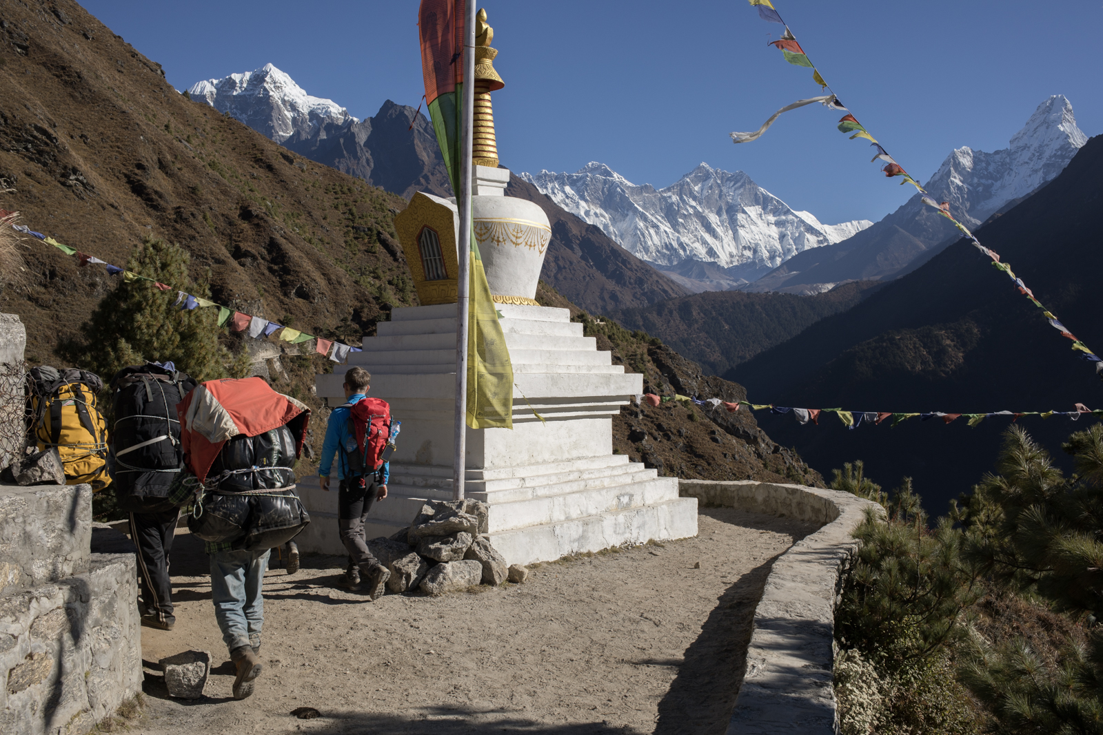 During this section of our hike we encountered large crowds leaving Namche. We would trek along the hillside before climbing down and up another river valley where we would cross a rhodedendren forest before reaching Tengboche. 