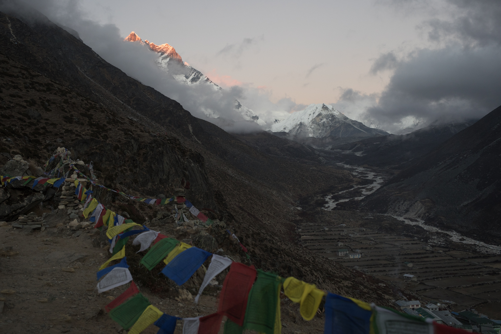 As clouds roll in for the evening a final touch of light spreads across the peak of Lhotse. As part of the acclimatization process, we would stay in Dingboche for a day to allow our bodies to get used to the elevation. We would take short walks to allow our bodies to acclimatize in movement. I walked to the ridge at night to watch the sunset. LtoR: Lhotse 8,516 m / 27,940 ft, Shartse 7,457 m / 24,465 ft, Island Peak 6,189 m / 20,305 ft.