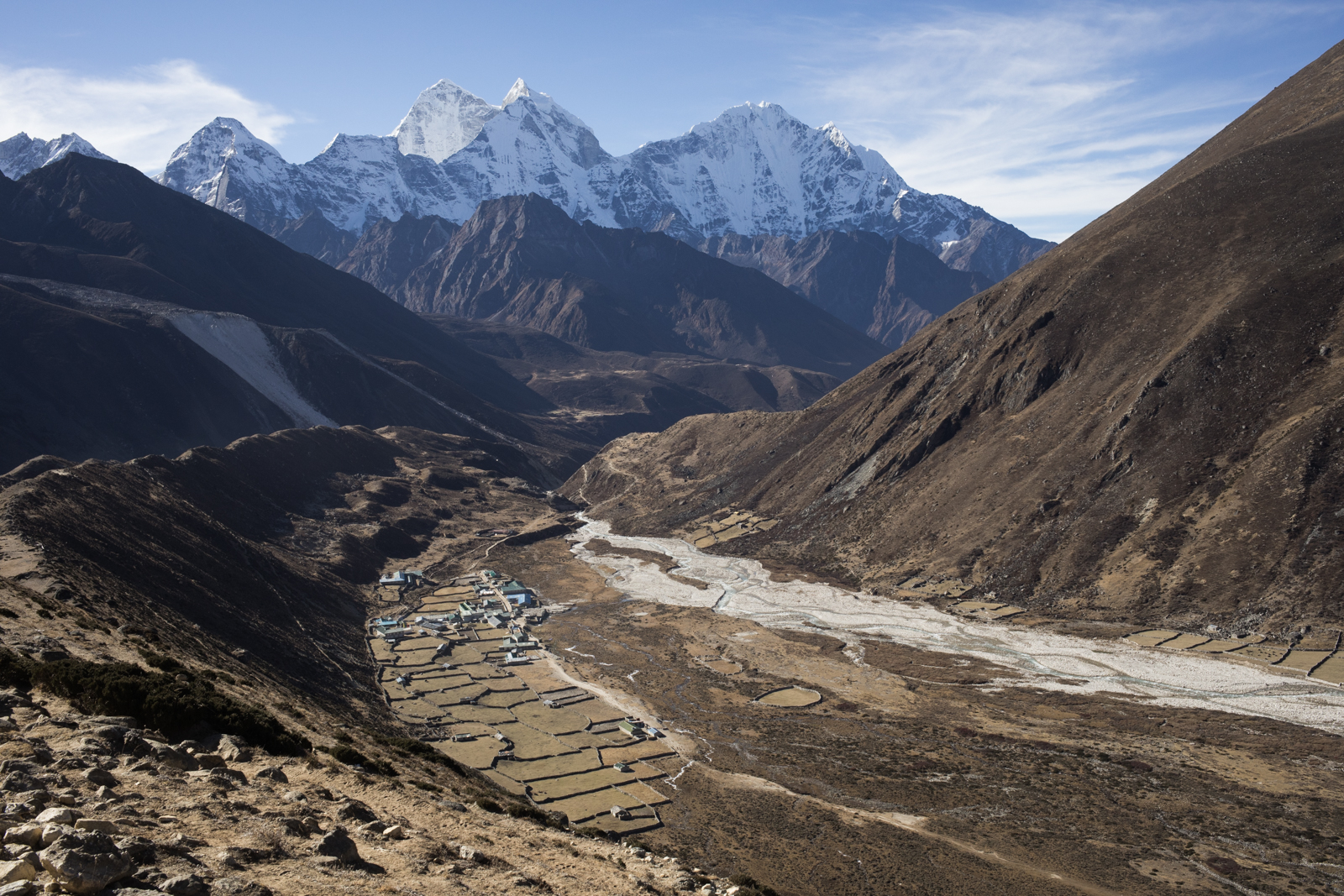 While on the Everest Base Camp Trek you rarely get a day where you hike along a flat section for more than a few minutes. However, today our hike started out as a simple ridge traverse. The views were stunning as we hiked above the village of Pheriche. Left: The sharp double peak Kangtega 6,779 m / 22,241 ft, and to the Right: Thamserku 6,623 m / 21, 729 ft. 