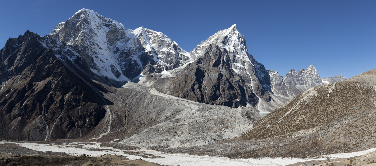 Our leisurely hike along the ridge slowly became a climb. We stopped for tea and then began the assent. Left to Right: Taboche 6,495 m / 21,309 ft, Cholatse 6,440 m / 21,129 ft.