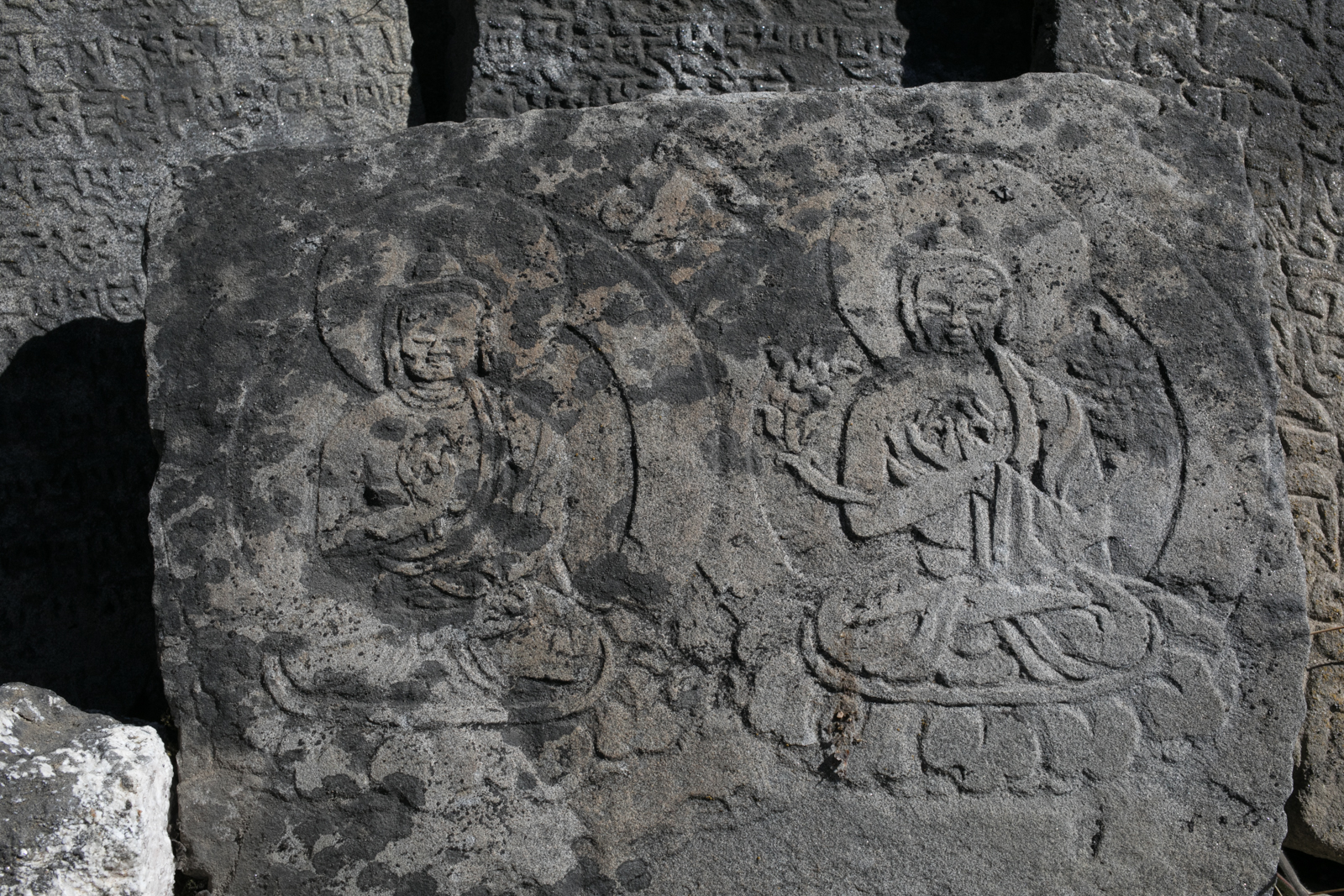 Stone carvings. Mani stones. 