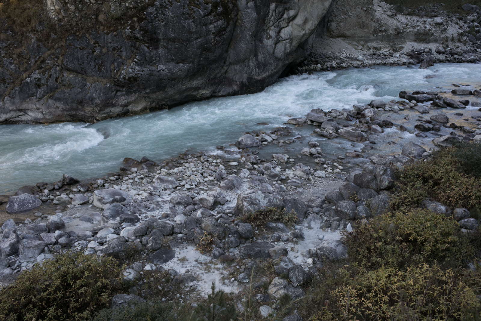 Koshi Nadi river. We hiked through Namche and on to Lukla. We made good time, moving along familiar landscape. As we approached Lukla the crowds grew and we began to see more developement. I stuck to the river, watching the cold water flow from Everest. 