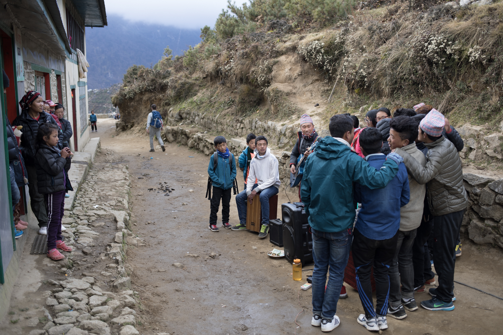 A group of young kids gathered together on the outskirts of town to pay music for a small group of locals. I ran into them as I returned from an acclimatization hike. They had mics, electric guitars and were holding each other as they sang. 