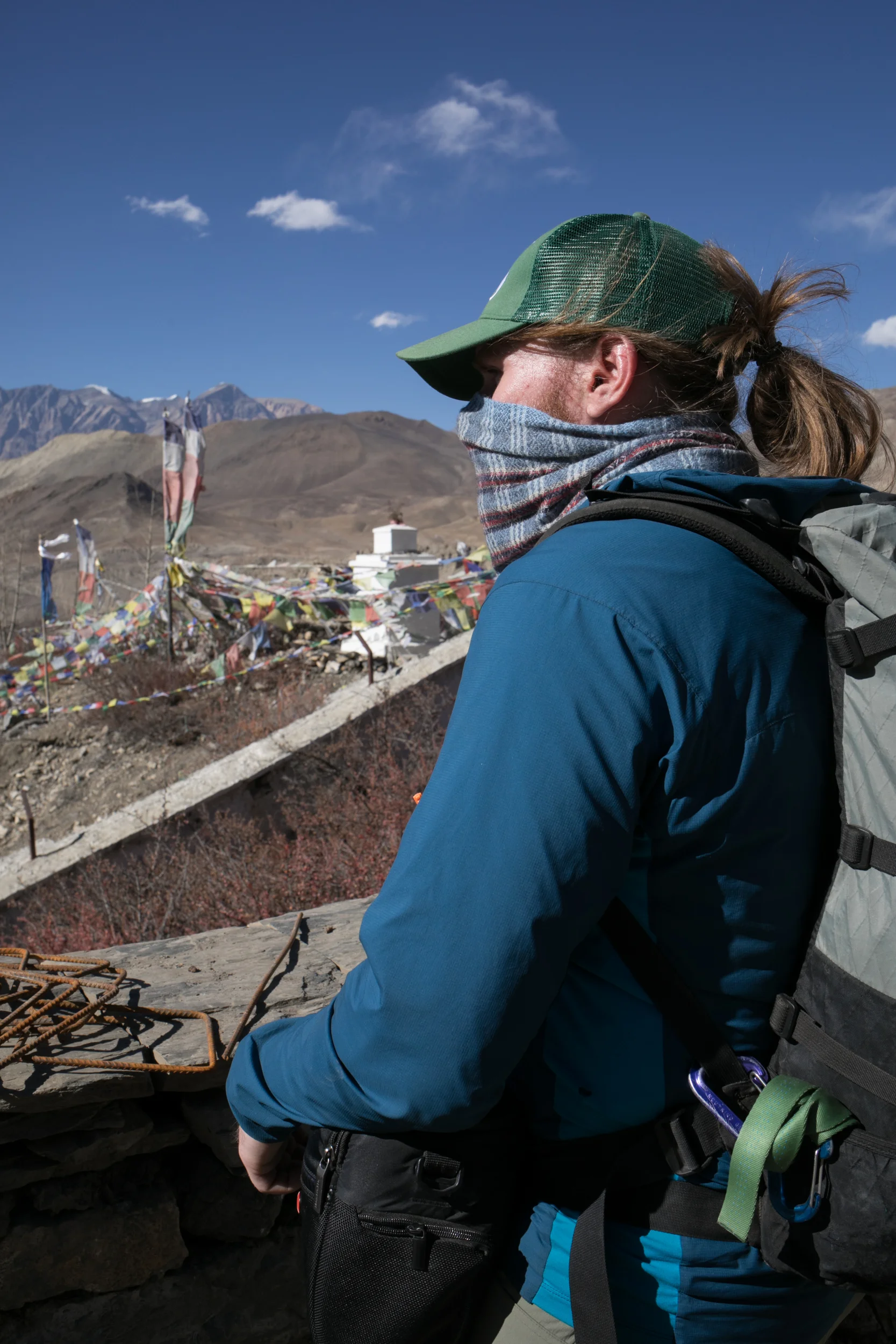 Aaron looks out over the town of Muktinath as we visit the temples. Muktinath has both Buddhist and Hindu temples. The Hindu temple had washing pools and fountains, bells, and incense with powdered dyes. The Buddhist Gompas were small and quite with butter lamps and intricate paintings. A little further along the ridge we passed by large statues. 