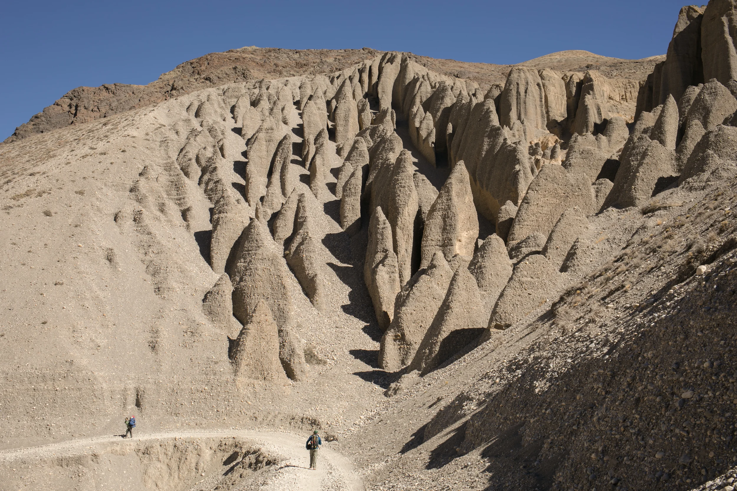 Towers of sand and stone stood like small sandcastles you build as a child. The towers seemed to weave in and out of each other and stood collected in groups in the hillside. 