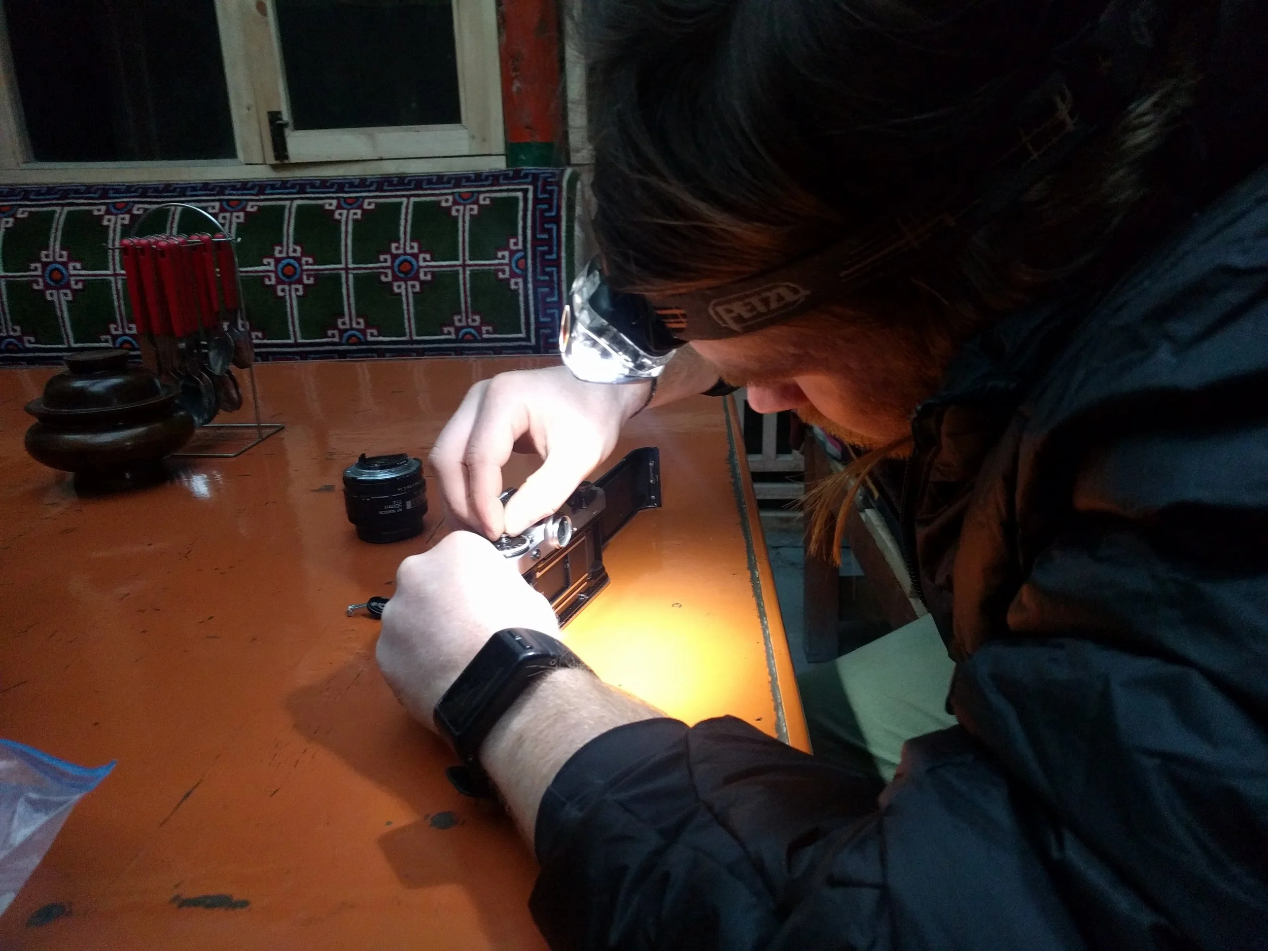 Aaron fixing his film camera. 