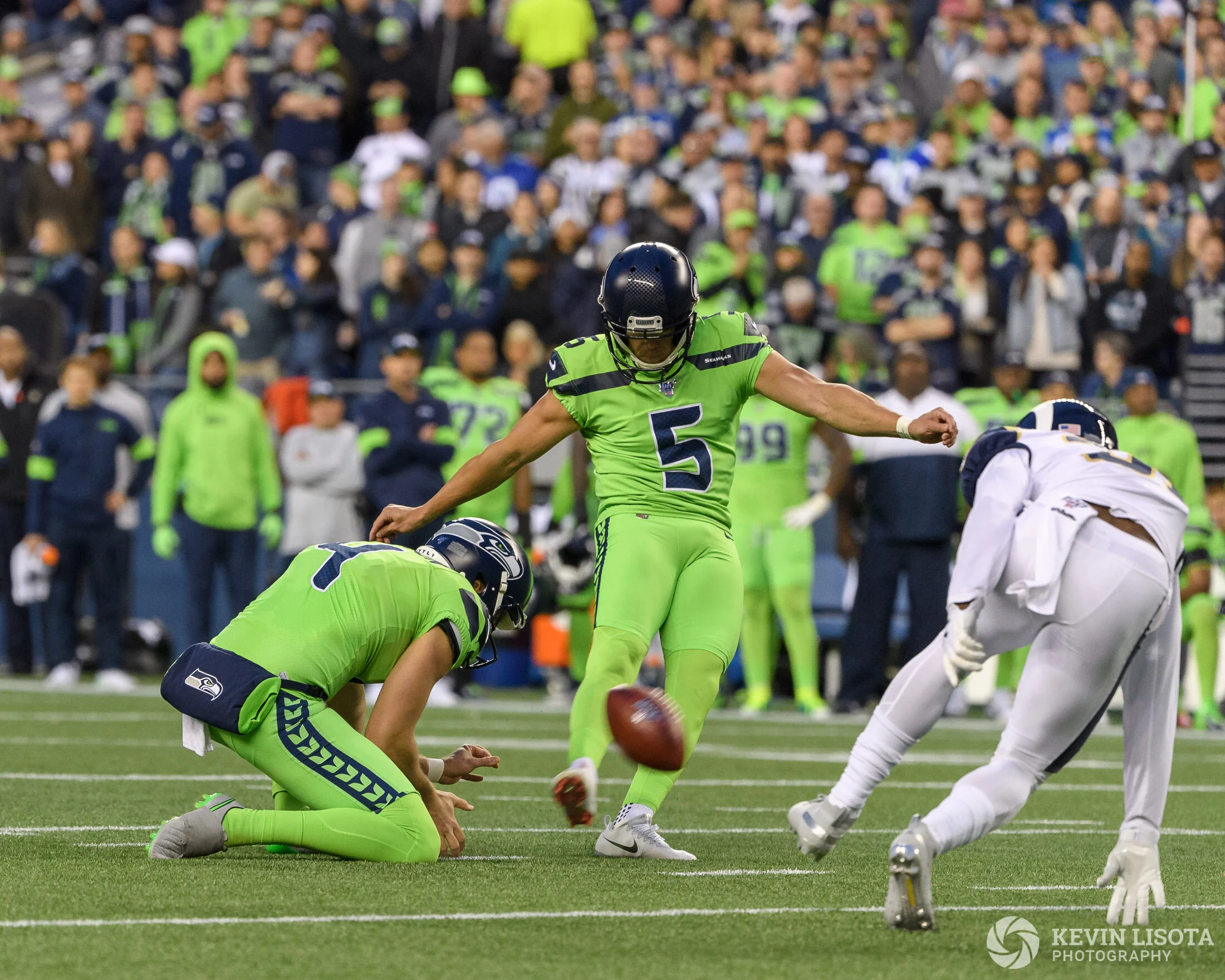 1/1000 sec shutter speed not fast enough to stop the motion of the kicked ball.