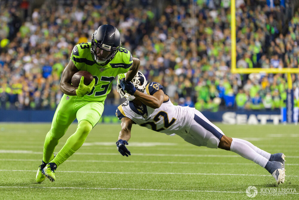 David Moore breaks a tackle to score a touchdown.