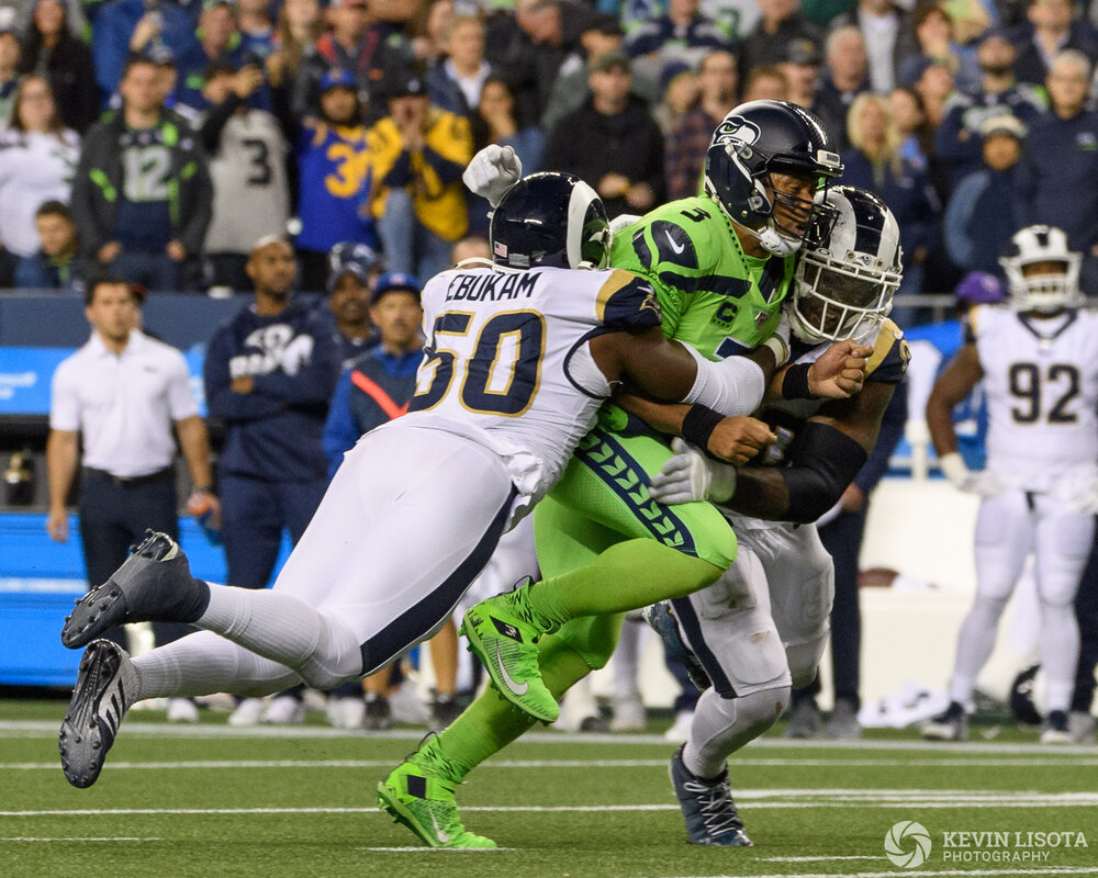 Russell Wilson gets tackled.