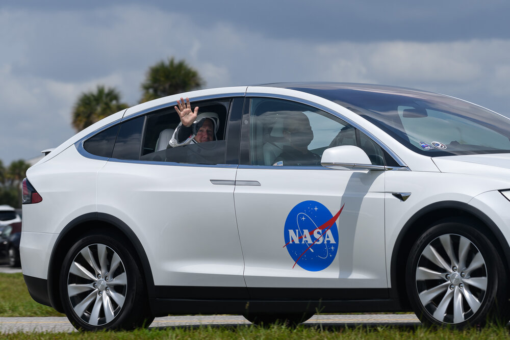 NASA astronaut Doug Hurley travels to Launch Complex 39A aboard a Tesla.