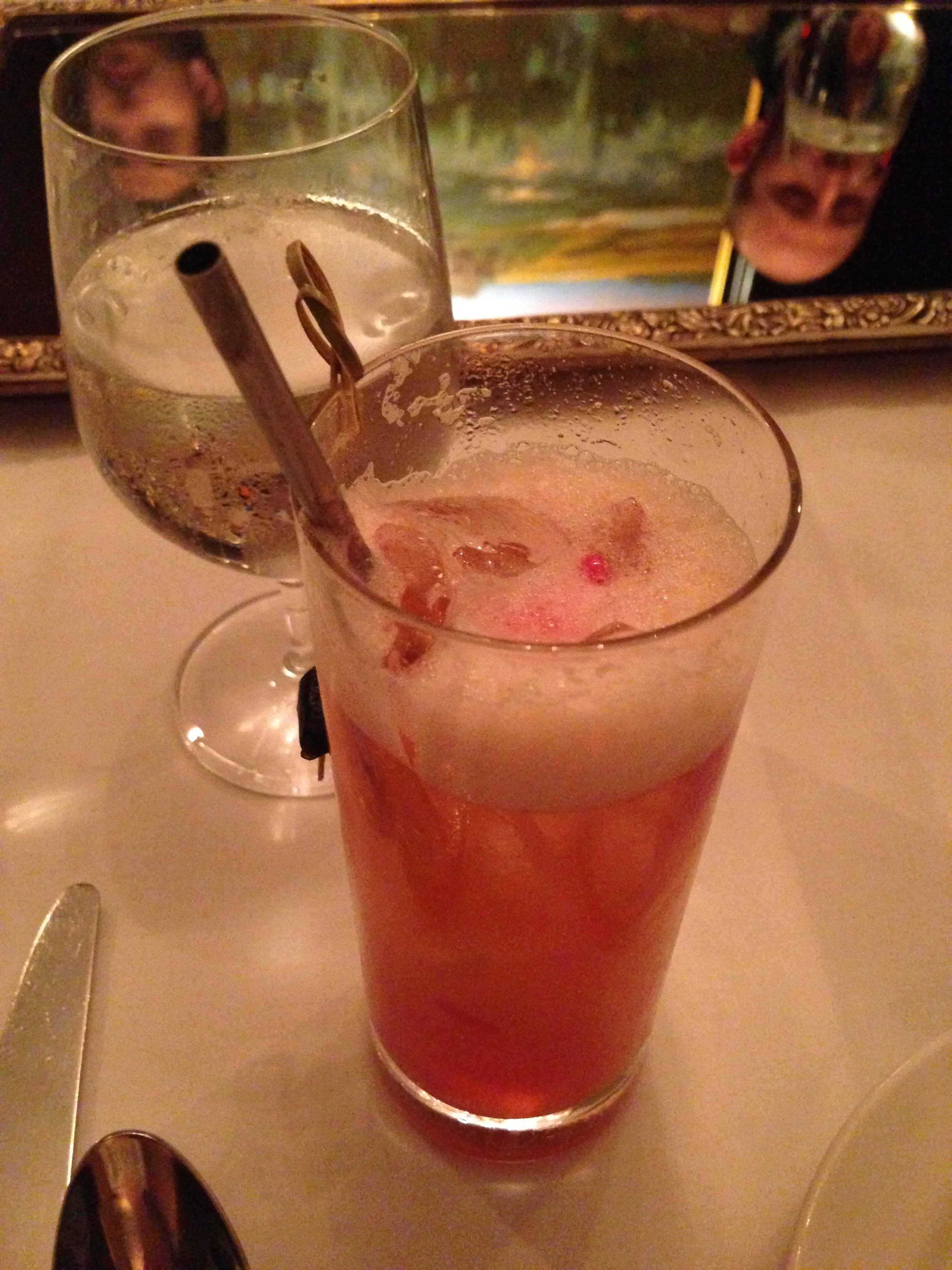 Cocktail dotted with little gelatin pearls, just waiting to be sucked up the metal straw. I really want metal straws for my kitchen, for no discernible reason. And check out the mirror on the table.