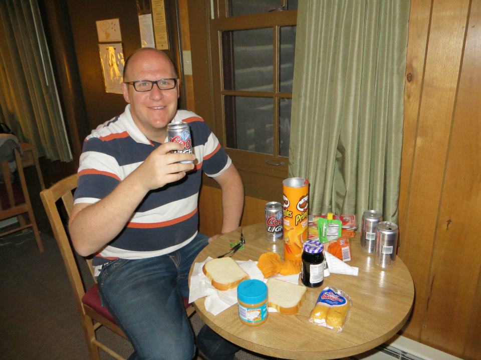 Dan is enjoying our picnic dinner.