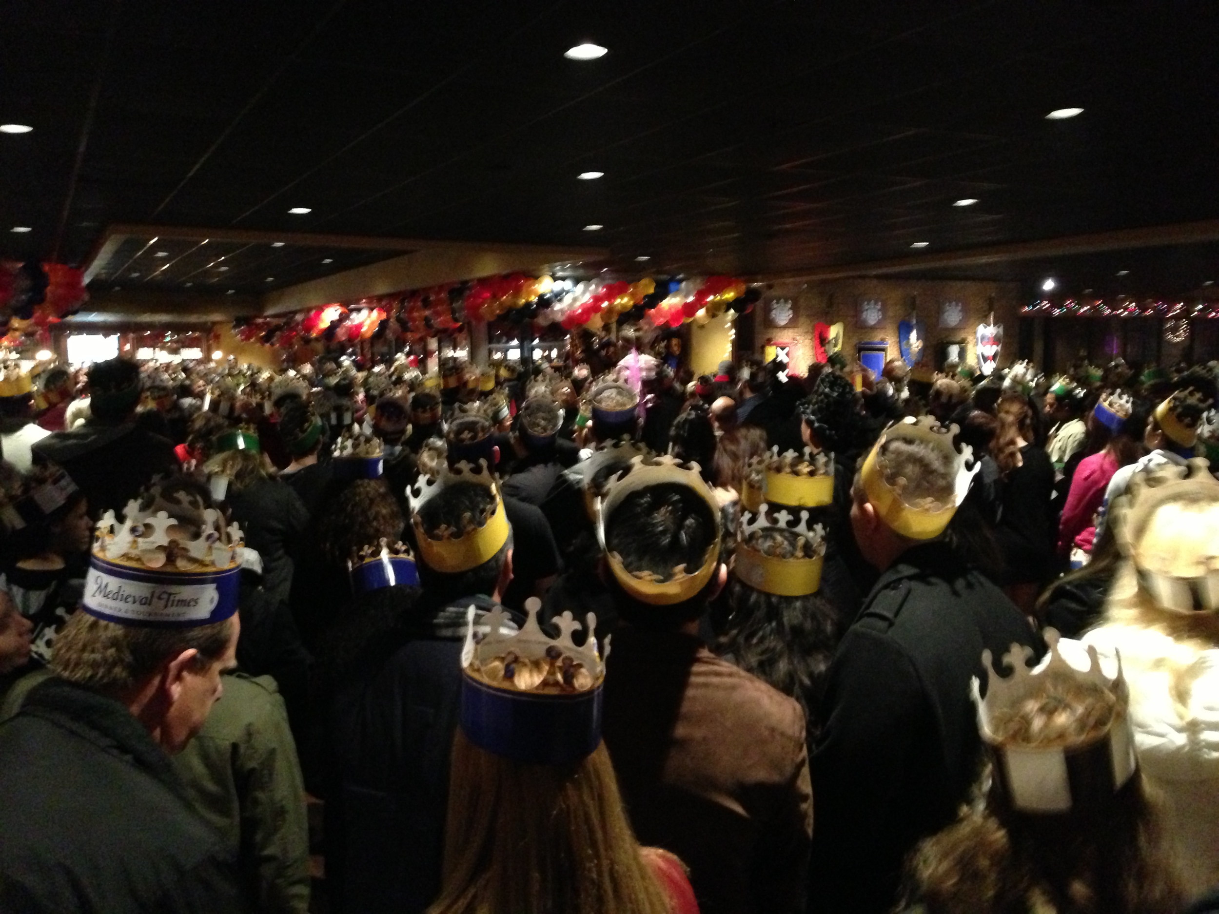  Everyone waiting to go inside. The MC actually started pitting color groups against each other and I thought that there would be a riot as a family with red crowns was very vocal behind us.&nbsp; 