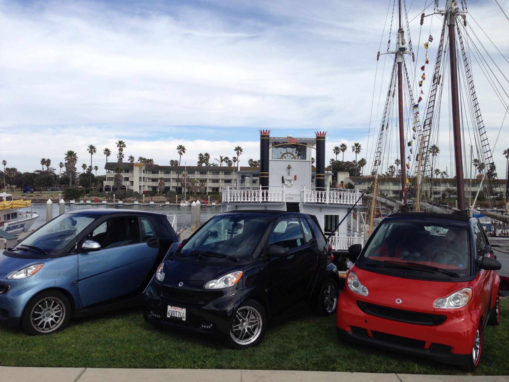  ​Our Smart (Black one in the middle) in front of our boat, The Scarlett Belle 