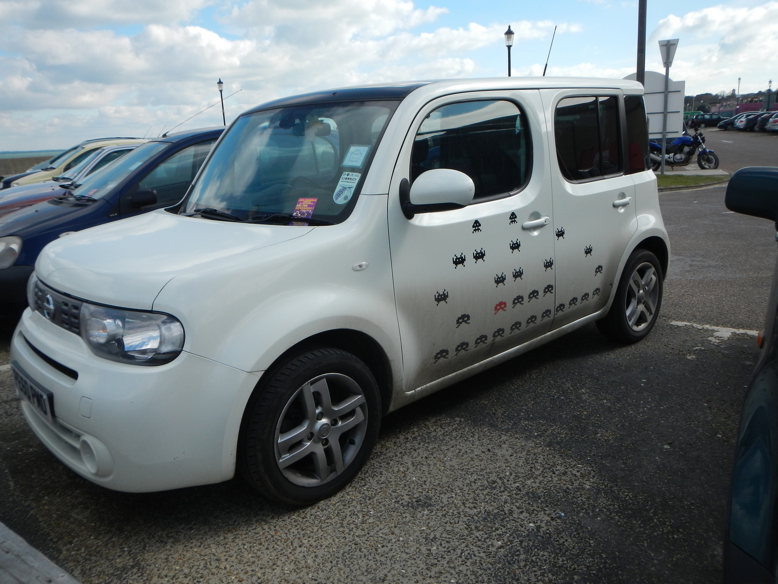  ​Space invaders Car in a parking lot on the Isle of Wight. 