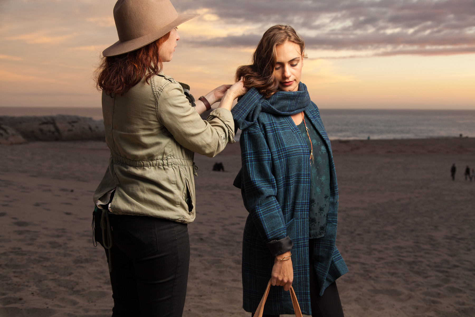  Christa adjusts the scarf. 