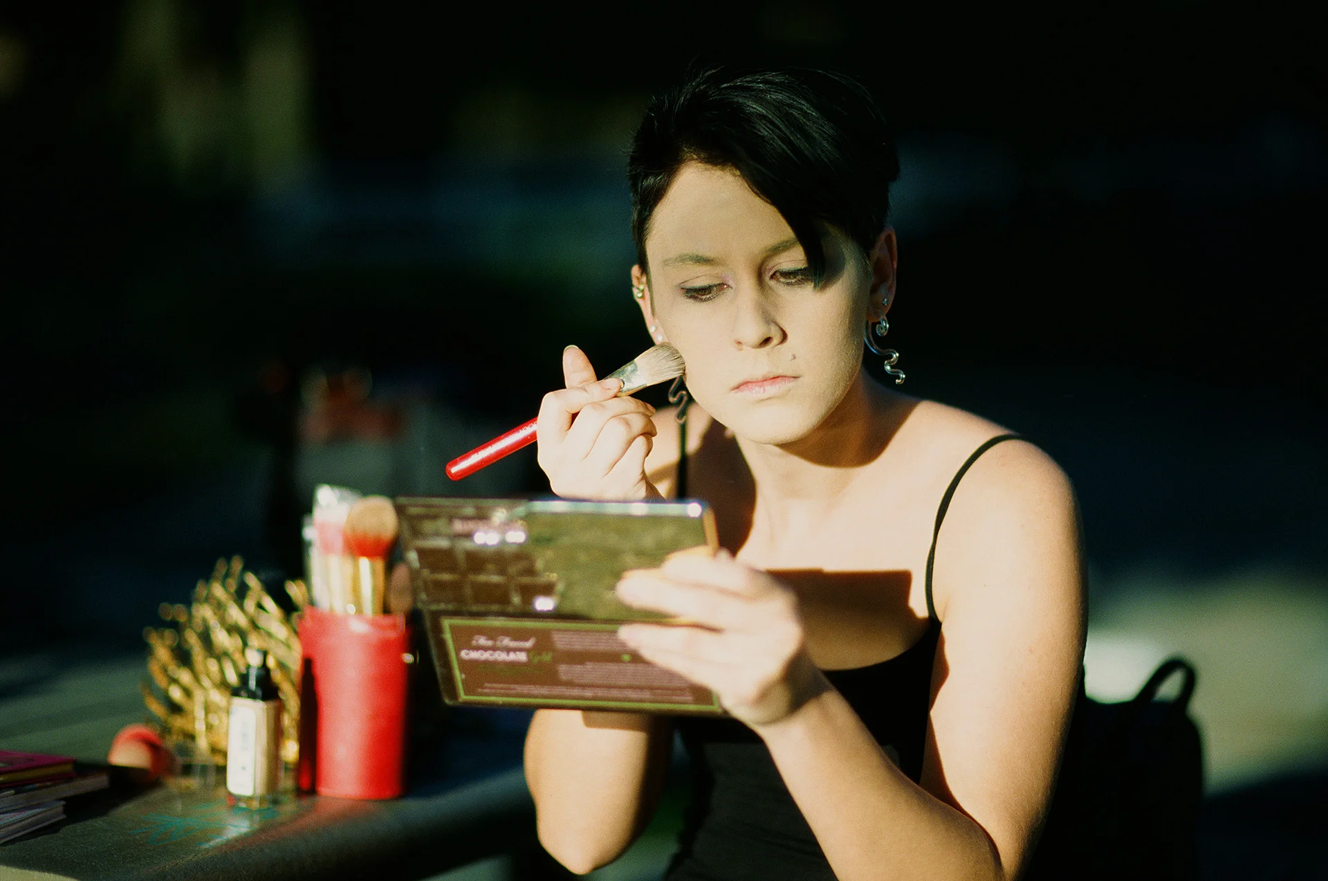 Unedited scan. Had to try and darken this in scanning because it was overexposed. Also notice the green cast. This was taken as she was prepping and the sunlight was so strong that it was overexposed at 1/8000th F/1.2. This was just on the edge of totally overexposed but with a bit of detail left. Since it was just a behind the scenes snapshot it was fine but I used my handheld light meter for the actual shoot.