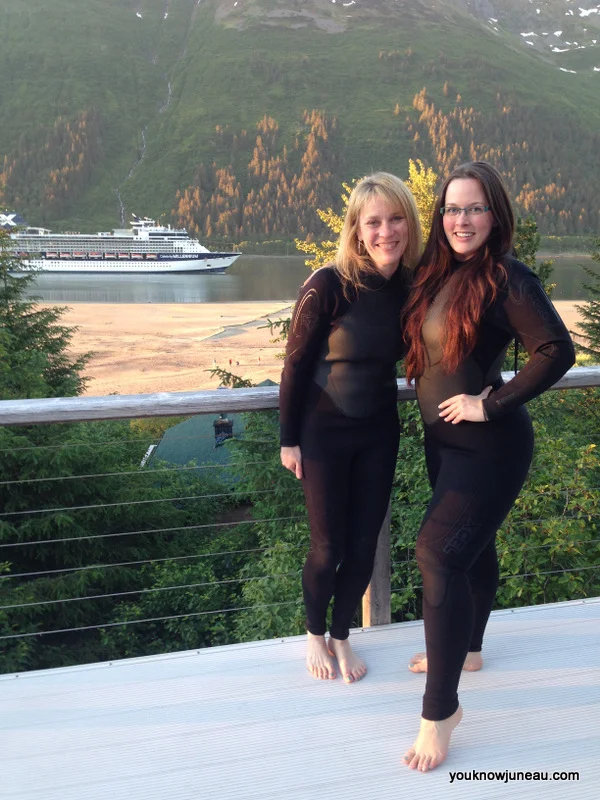 Getting outfitted in our wetsuits. Mount Roberts and the Gastineau Channel in the background.