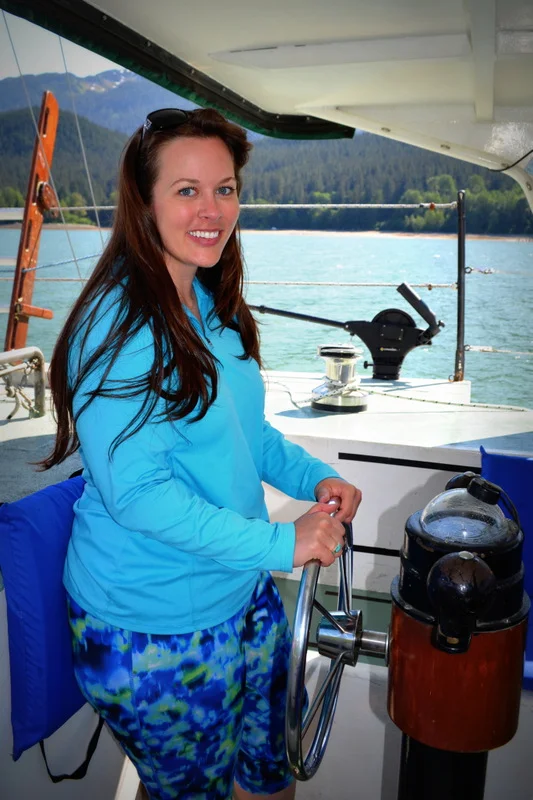 At the helm of the S/V Arcturus .