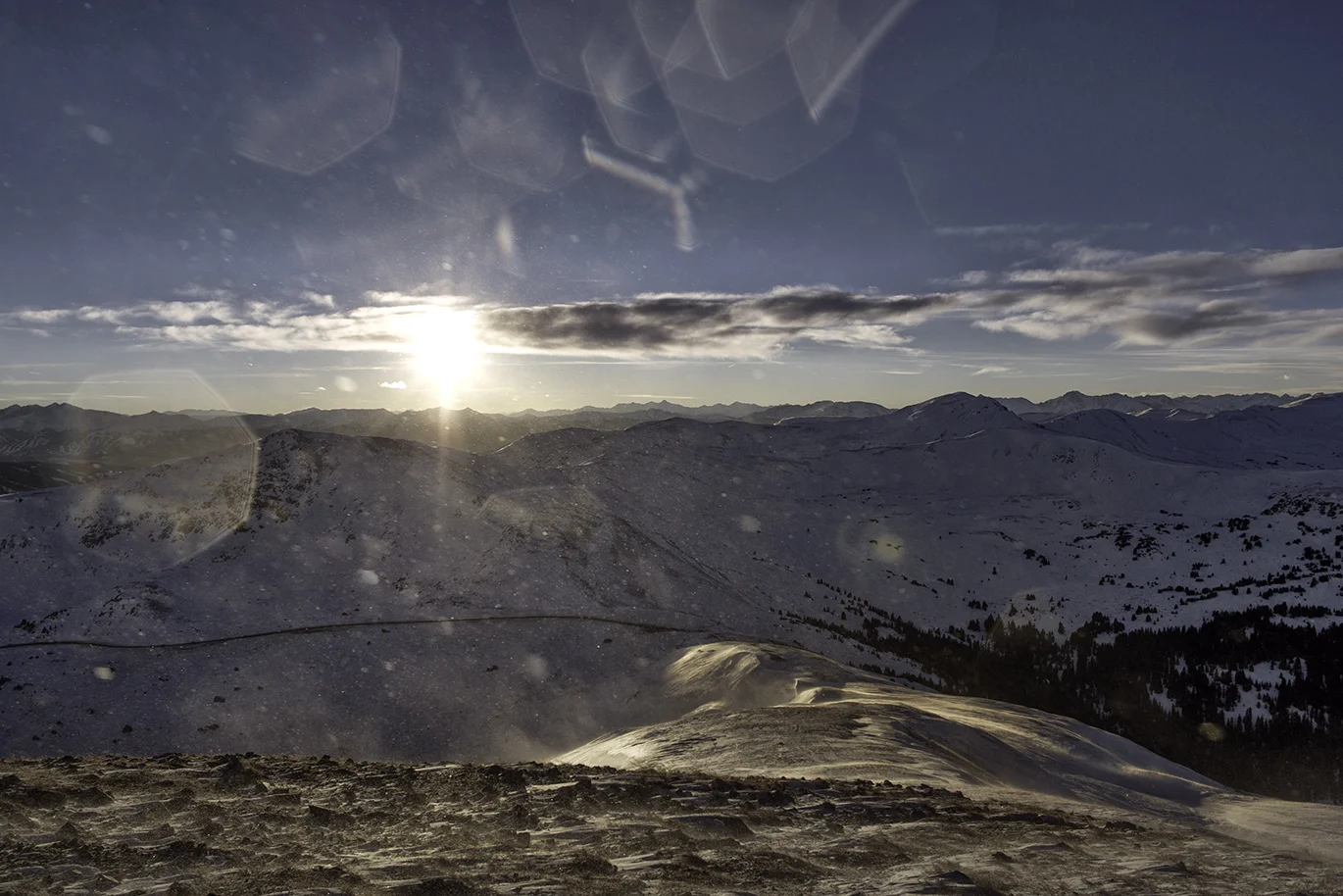 Spectacular views towards the west from the first hill on the Continental Divide from Loveland Pass. U.S. Hwy 6 is visible in the photo along with a portion of the parking lot at Loveland Pass. Winds on the ridge are commonly in excess of 50 mph.