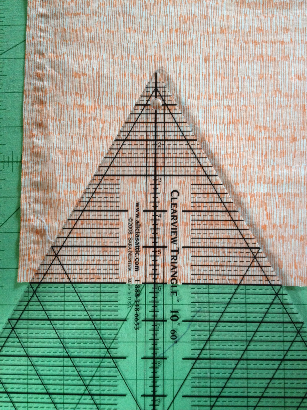 On this ruler, the number at the base is actually the height of the triangle, so if you are going for 6" tall, as I am, use the line for 6.