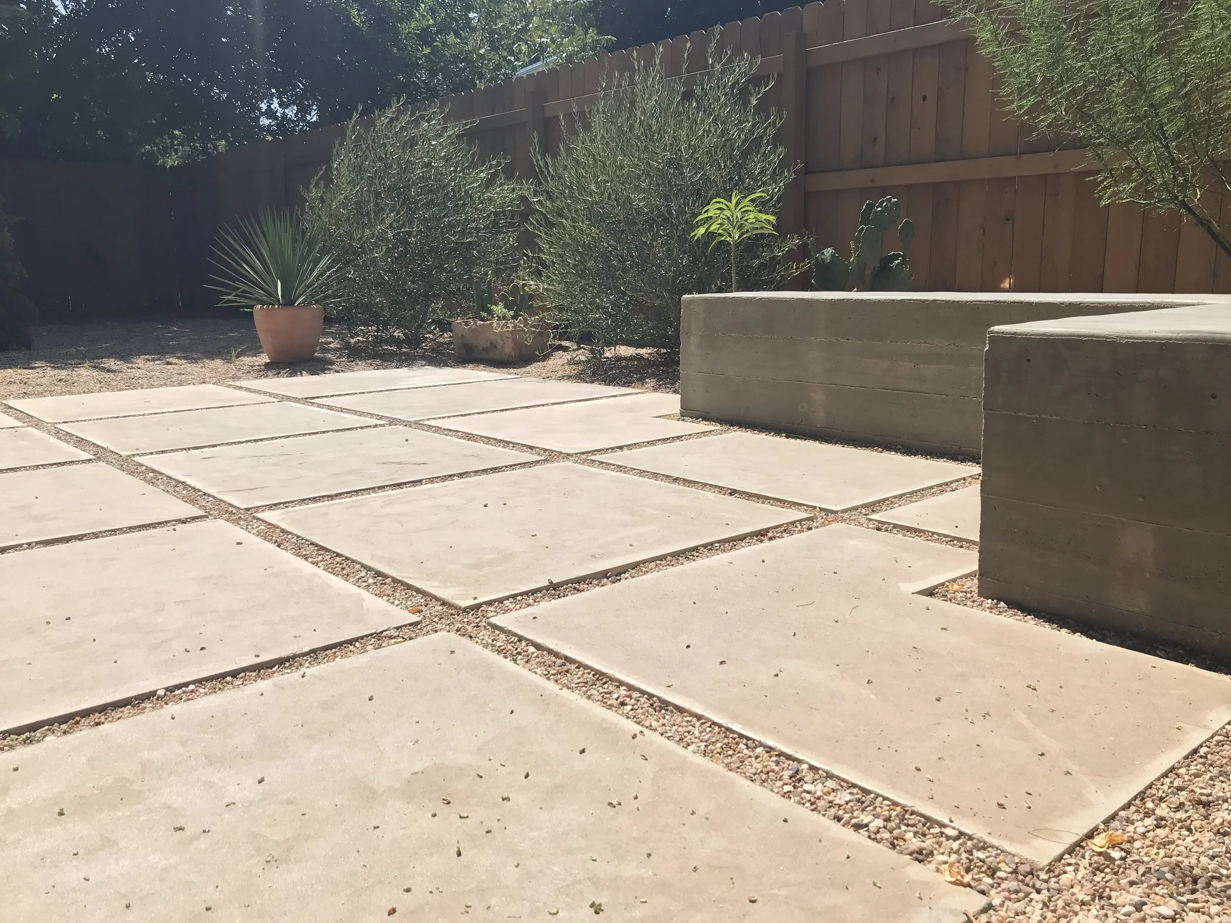 Outdoor patio with concrete pavers and desert plants