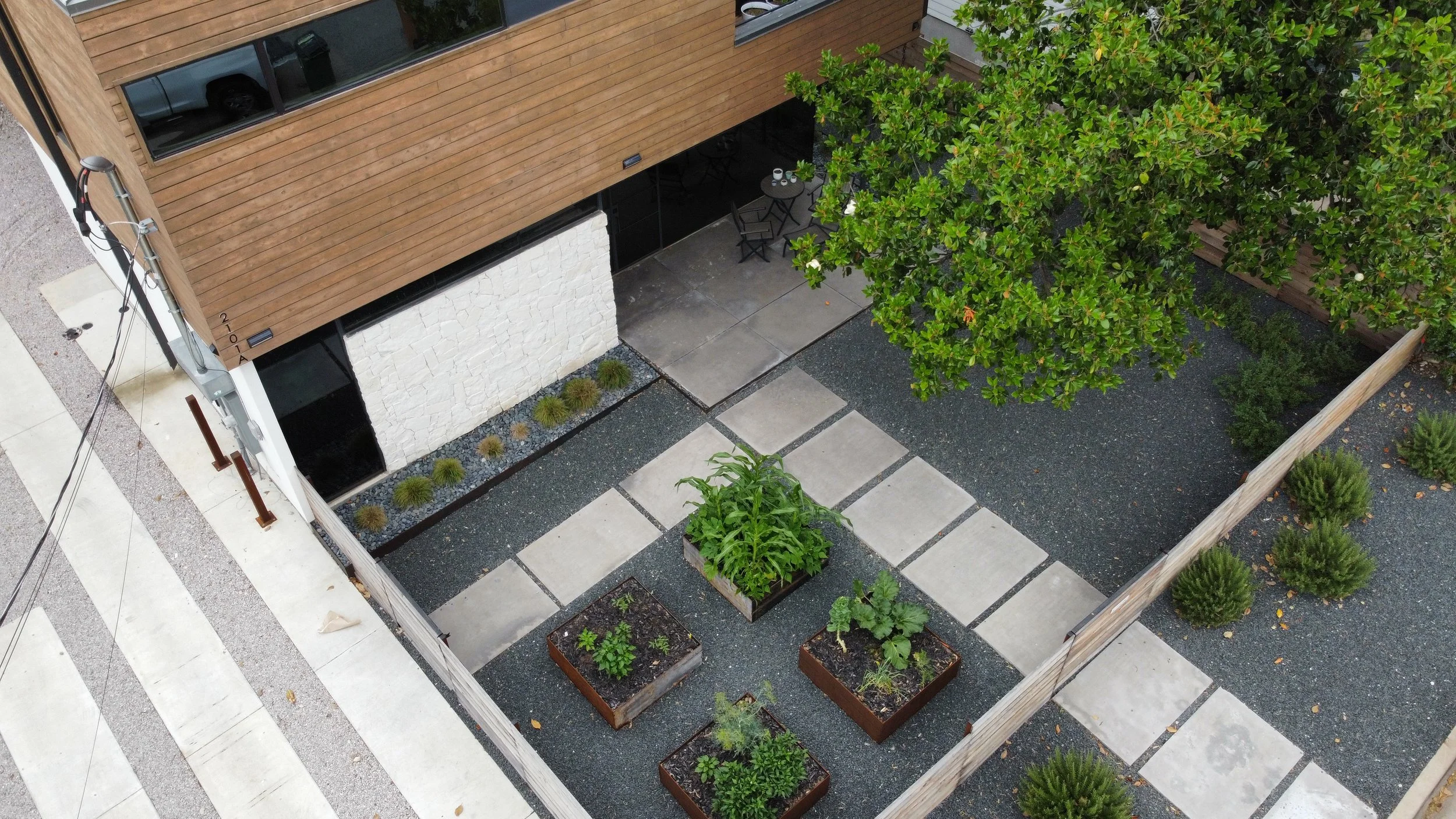Aerial view of a modern home's green garden.