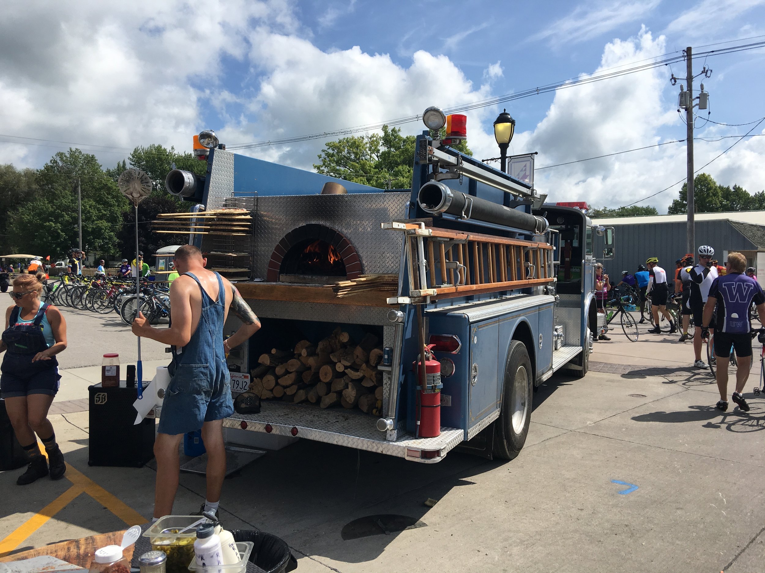 Wood fire oven pizza. Oven was retrofitted into the back of an old firetruck.