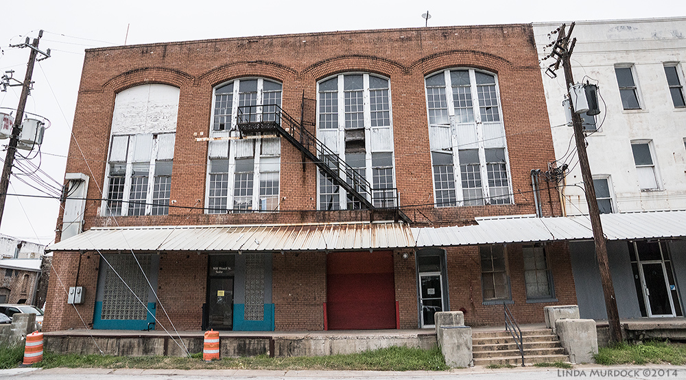 Notice the gap cut in the metal awning for the fire escape exit Sony A77 II with 16-50mm DT 1/320 sec. f/5.0 ISO 1000
