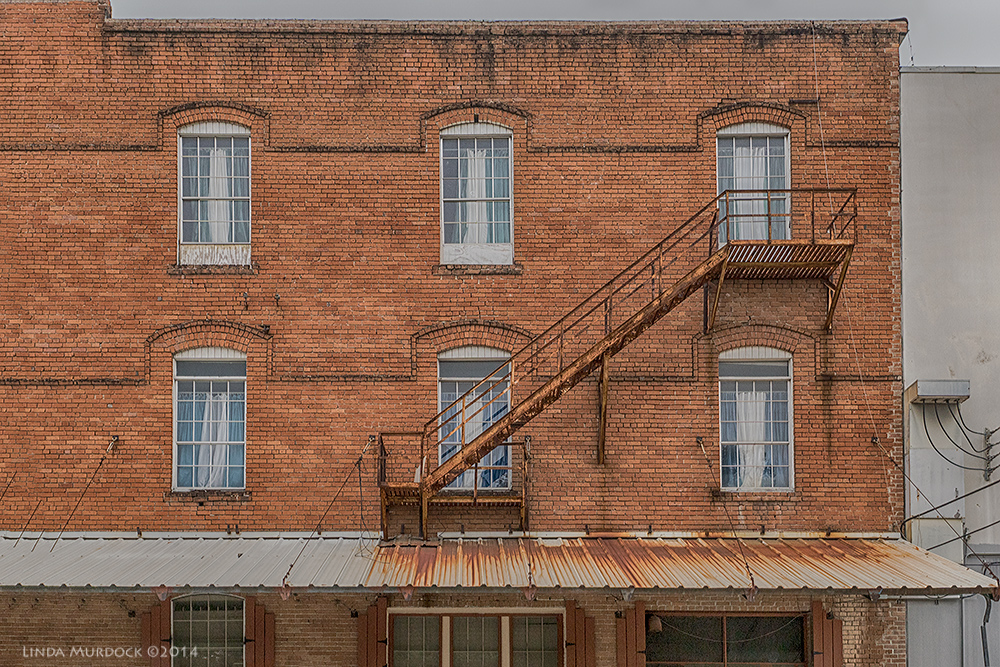 Fire escapes remind me of the Triangle Shirtwaist Factory Fire Sony A77 II with 16-50mm DT 1/250 sec. f/5.0 ISO 1000
