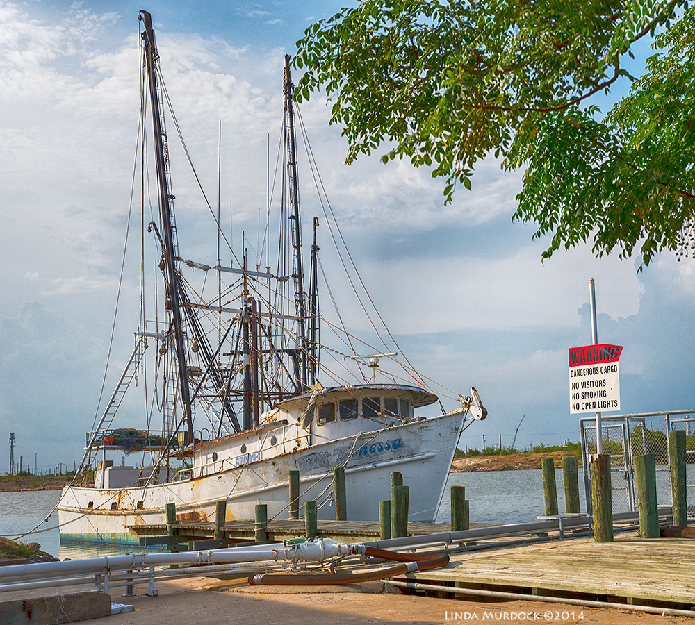 Old shrimp boat moored at Freeport Sony A77 II with DT 16-50mm 1/1600 sec. f/6.3 ISO 400
