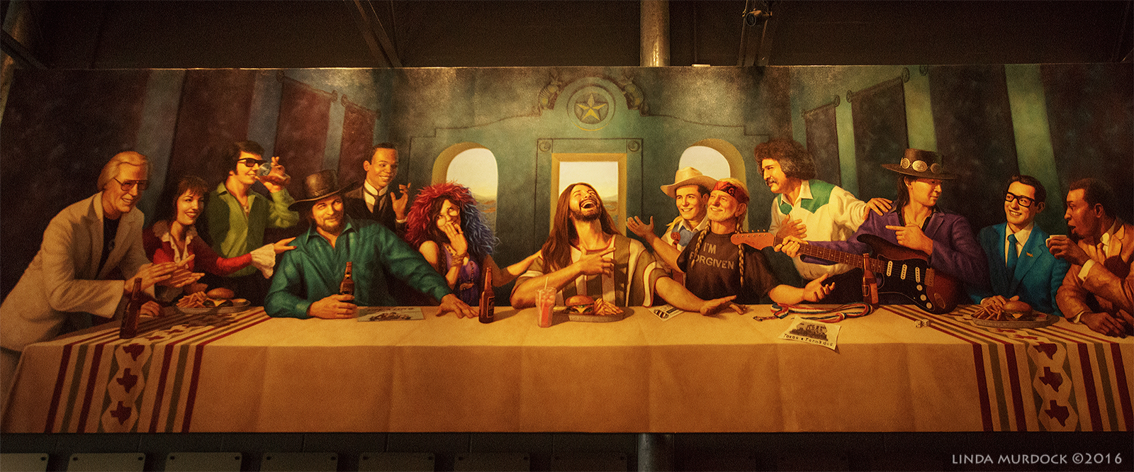 Giant mural oversees patrons at fancy burger joint on the square Sony A77II with Sigma f/3.5 10-20 mm f/3.5 1/400 sec ISO 2000