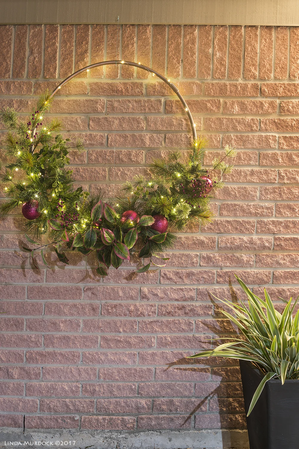 Lighted Christmas wreath Nikon D810 with Tamron 15-30 f/2.8 ~ ISO 64 f/7.1 30 sec at 30mm; tripod