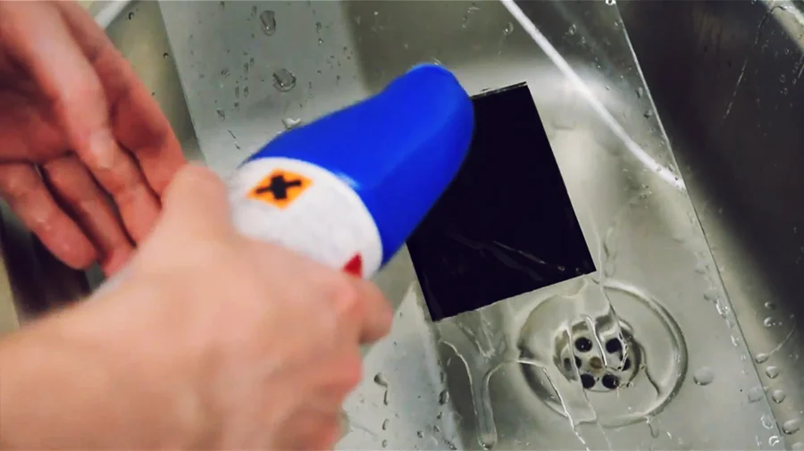 After you have coated the back of the sheet with bleach, leave it for around five minutes.