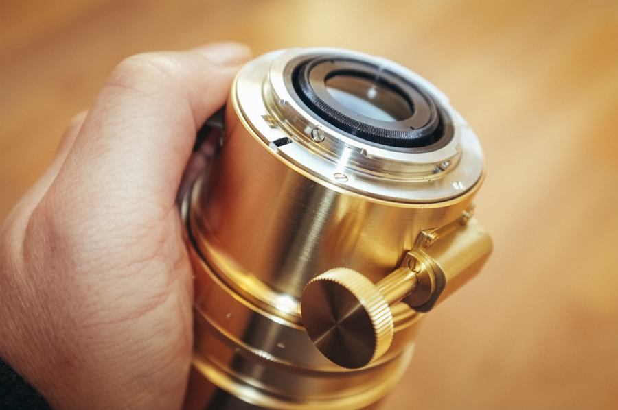 That big ol' dial thing there is actually how you focus the lens. When the lens is attached it sits at the base of the lens and is operated via your left hand.